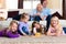 Family playing board game at home