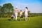 Family playing golf