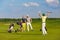 Family playing golf