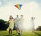 Family Playing Kite Summer Outdoors Leisure Concept
