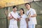 Family playing tennis, portrait