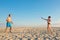 The family plays beach badminton. Sports, lifestyle. Family games in summer on vacation