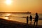 A family plays at the shoreline