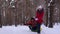 Family plays in the winter park during the Christmas holidays. Happy children and father winter sledding in the snow and