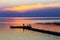 Family on pontoon pier at sunset