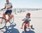 Family, portrait and cycling at the beach with girl and father on bicycle, happy and smile while learning, bond and