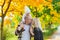 Family portrait of the father and daughter against the background Indian summer.