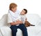 Family portrait on white background, happy people sit on sofa. Grandmother with grandchild.