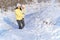 Family portrait in the winter forest, mother and child, bright sunlight and shadows on the snow, beautiful nature