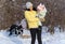 Family portrait in the winter forest, mother and child, bright sunlight and shadows on the snow, beautiful nature