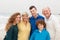 Family posing on beach background