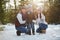 Family posing in winter park