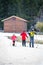 Family practicing cross-country skiing. The volcano Mount Etna, Sicily. Italy.