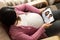 Family and pregnant woman video call while stay safe at home during covid-19