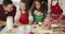 Family preparing christmas cookies in the kitchen