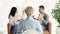 Family Psychotherapist Sitting Back To Camera During Appointment In Office