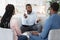 Family Psychotherapy. African American Couple Listening To Counselor`s Advices During Therapy Session