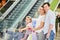 Family pushes kids in shopping cart