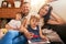 Family puts the heart into a home. Portrait of a happy young family of four relaxing together on the sofa at home.