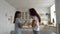 Family quarrel of mother with daughter standing in own apartment and arguing with each other