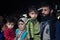 Family of refugee, man and woman, holding their children, waiting to cross the Croatia Serbia border, on the Balkans Route