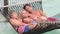 Family Relaxing In Beach Hammock