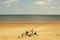 Family relaxing on the beach on Prince Edward Island