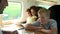 Family Relaxing On Train Journey