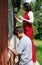 Family repairing house on the outside together.