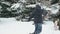 Family rests in winter forest, beautiful landscape with snowy fir trees