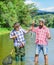 Family reunion time. father and son fishing. male friendship. family bonding. summer weekend. two fishermen with fishing