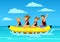 Family riding banana boat. summer vacation time