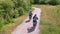 The family is riding bikes on the cycle path