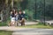 Family riding four wheel bicycle