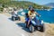 Family riding quad bike. Cute boy and his father on quadricycle. Motor cross sports on Greece island. Family summer