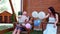 Family riding on a swing, portrait of a happy family, mom dad and son having fun, holding in his hand balloons, laughing