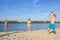 Family on the riverbank playing beach volleyball. Lifestyle