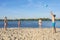 Family on the riverbank playing beach volleyball. Lifestyle. Sport games