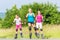 Family rollerblade with skates on country lane