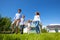 Family running on lawn near house