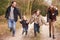 Family Running On Winter Countryside Walk Together