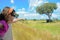 Family safari vacation in Africa, child in car looking at elephant in savannah, Kruger national park