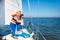 Family sailing. Mother and child on sea sail yacht.