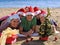 Family with Santa Claus hat on beach