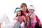 Family in Santa\'s hat sitting in artificial snow