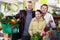 Family satisfied with shopping in greengrocery