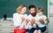 Family school. Woman and man helps the child boy Counting on fingers. Supporting pupils at school. Nice family photo of