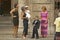 Family setting with little Rickie in a Tuxedo preparing to enter event in Old Havana, Cuba