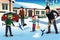 Family shoveling snow in front of their house