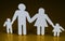 Family silhouettes with children isolated on yellow background